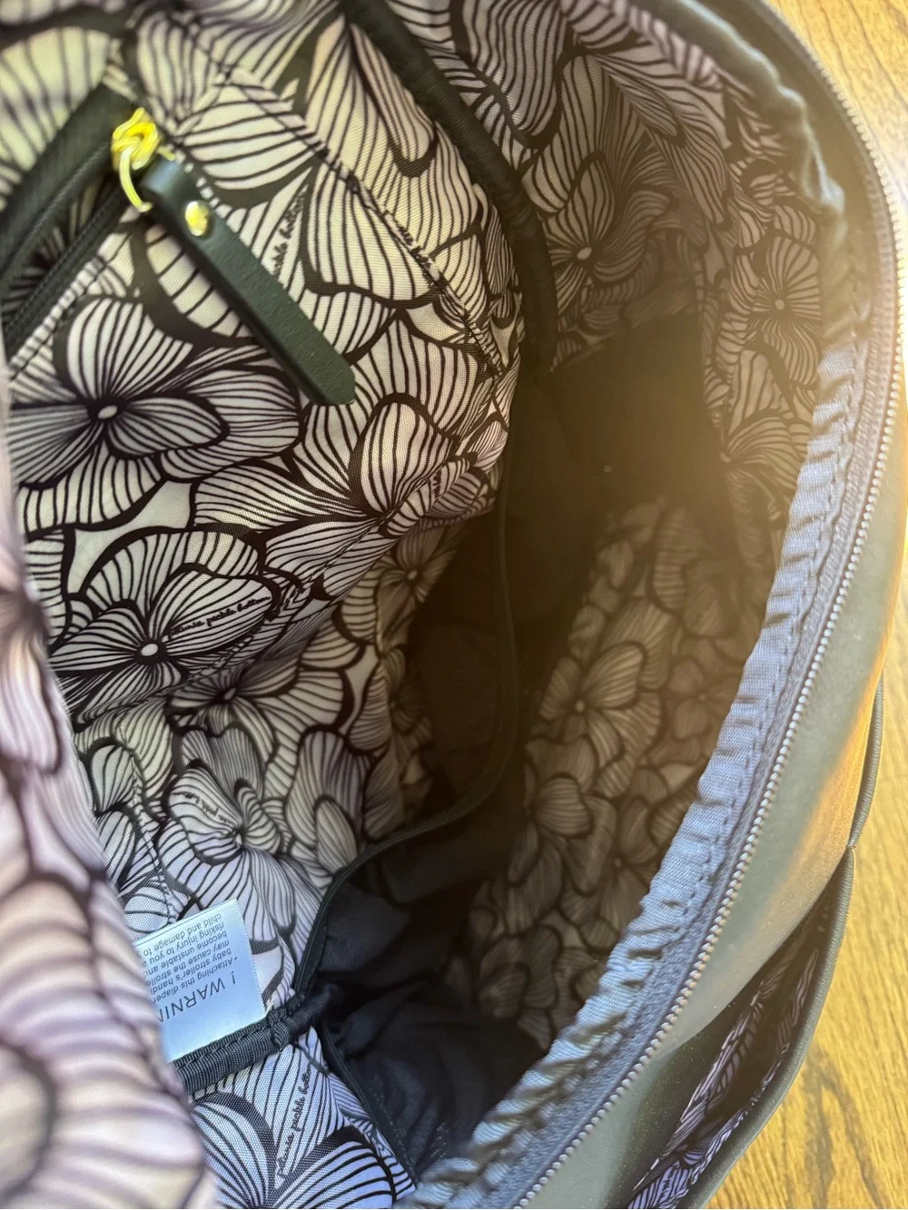 Petunia Pickle Bottom Black Diaper Backpack with Gold Accents